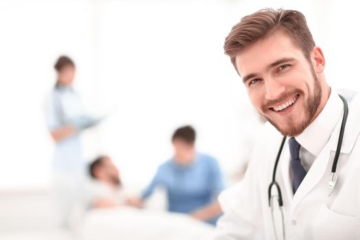closeup.smiling doctor on blurred background.