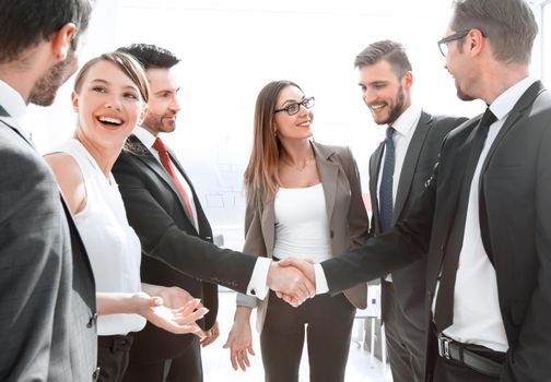 Business handshake in a modern office