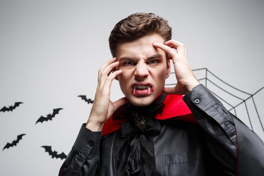 Vampire Halloween Concept - Portrait of Angry caucasian vampire screaming.