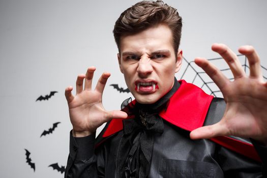 Vampire Halloween Concept - Portrait of Angry caucasian vampire screaming.