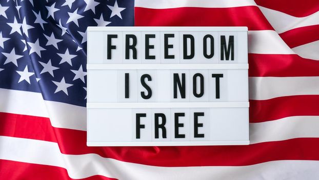 American flag. Lightbox with text FREEDOM IS NOT FREE Flag of the united states of America. July 4th Independence Day. USA patriotism national holiday. Usa proud.