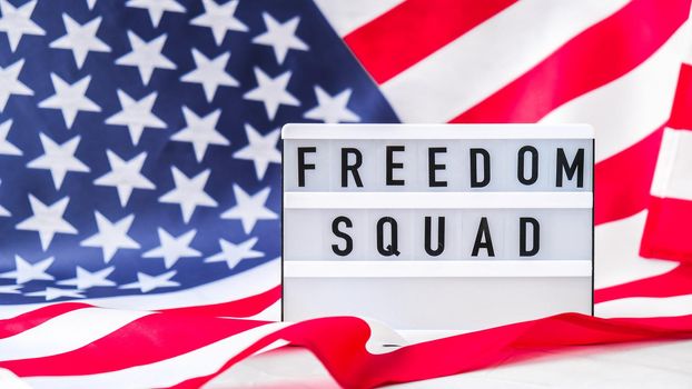 American flag. Lightbox with text FREEDOM SQUAD Flag of the united states of America. July 4th Independence Day. USA patriotism national holiday. Usa proud.