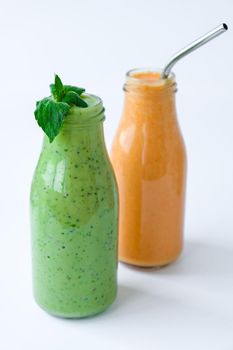 Seasonal Matcha green vegan smoothie with chia seeds and mint pumpkin carrot smoothie drink detox Breakfast. Clean eating, weight loss, healthy dieting food concept