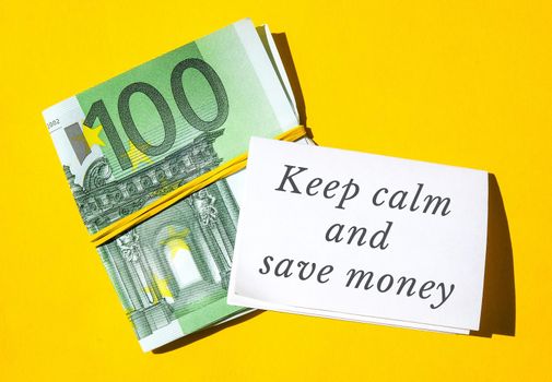 KEEP CALM AND SAVE MONEY Quote euros close up. Money currency. Online shopping. Business budget of wealth and prosperity finance, buy coin. Salary investment savings