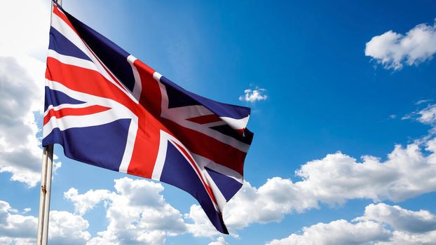 UK, United Kingdom, Union Jack flag waving in sky
