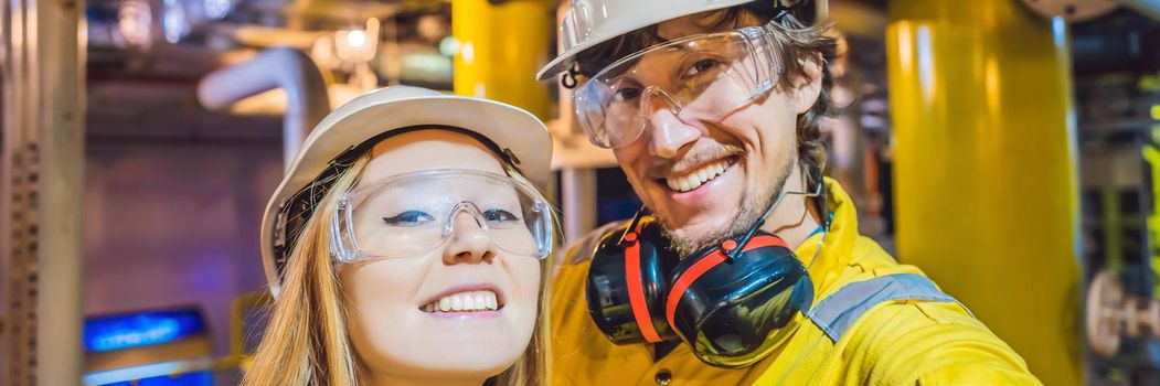 Man and woman in a yellow work uniform, glasses, and helmet in an industrial environment, oil Platform or liquefied gas plant BANNER, LONG FORMAT