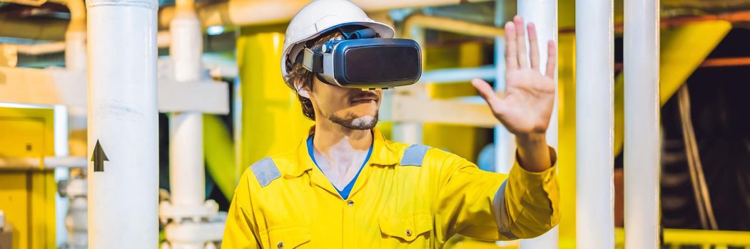 BANNER, LONG FORMAT Young woman in a yellow work uniform, glasses and helmet uses virtual reality glasses in industrial environment, oil Platform or liquefied gas plant