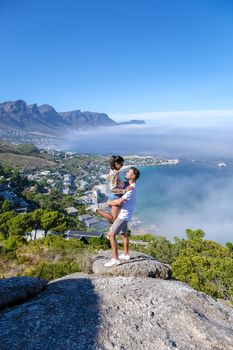 view from The Rock viewpoint in Cape Town over Campsbay, view over Camps Bay with fog over the ocean in Cape Town South Africa
