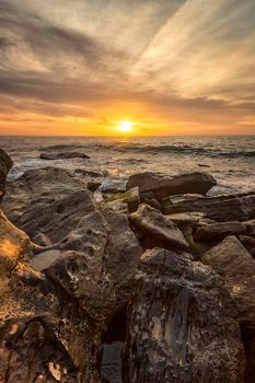 Stunning sea sunrise among the rocks at the Black Sea shore near Varna, Bulgaria