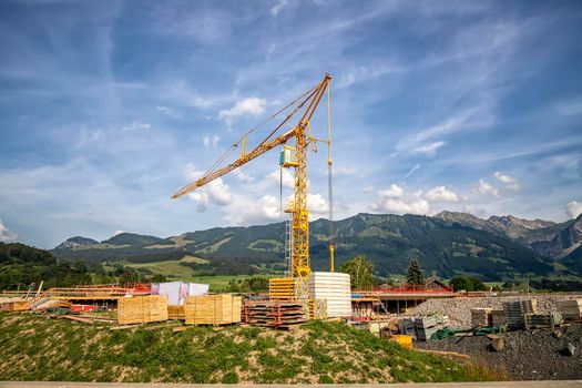 Scenic view at a new construction site with crane and building materials.