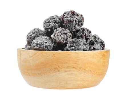 Salted Black plum in wooden bowl isolated on white background, save clipping path.