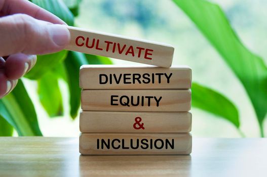 Cultivate diversity, equity and inclusion text on wooden blocks.
