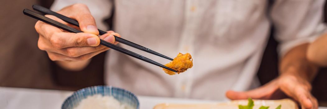 Bento set of prawn tempura and chicken teriyaki in japanese restaurant BANNER, LONG FORMAT