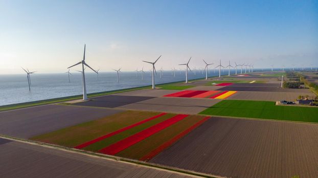 Huge windmill turbines, Offshore Windmill farm in the ocean Westermeerwind park , windmills isolated at sea on a beautiful bright day Netherlands Flevoland Noordoostpolder