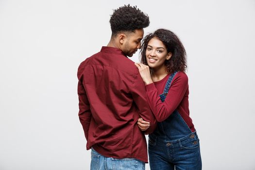 portrait of happy african american couple hug each other on white background.