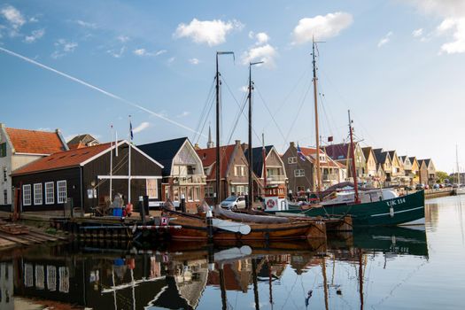 Urk Flevoland Netherlands a sunny spring day at the old village of Urk with fishing boats at the harbor