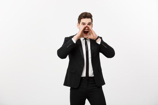 Business Concept: young handsome business man shouting and isolated on white.