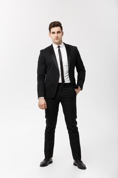 Full length Portrait Businessman posing stylishly on white background.