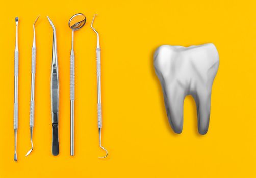Artificial tooth and dental instrument on table. Dental services concept