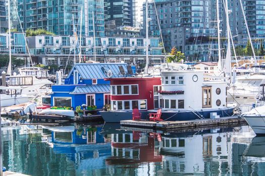 Houseboats docked in the marina at the Coal Harbour waterfront
