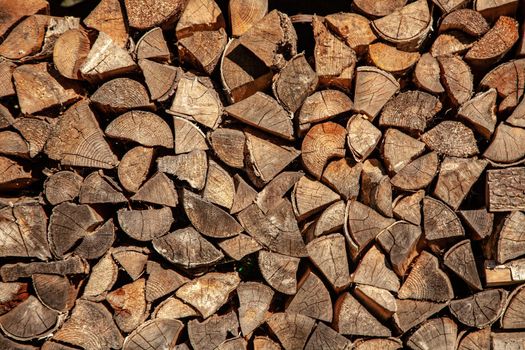 Firewood for firewood, Background of dry chopped firewood logs in a pile