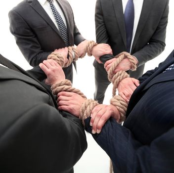 closeup.group of business people holding hands