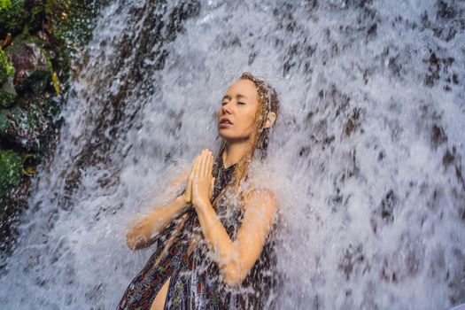 Young woman tourist in Holy springs Sebatu in Bali