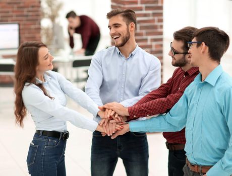 Group of people hands together partnership teamwork.