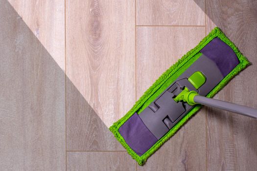 Housework - sweeper wet mop on laminate floors.