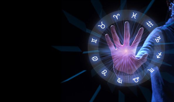 Zodiac signs inside of horoscope circle. Astrology with hand to stop.