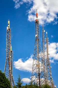 communication towers, antennas, transmitters and repeaters for mobile communications 