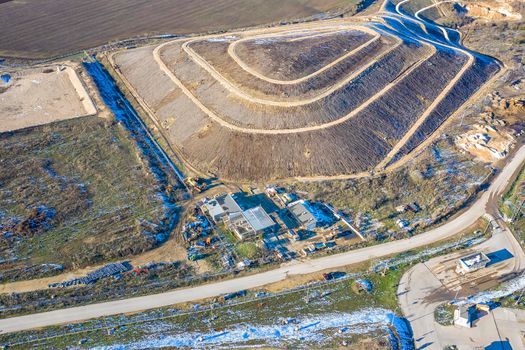 Aerial top view of a city garbage dump. Waste Disposal Facility