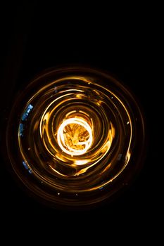 art of lighting of incandescent bulb. Close up. Vertical view