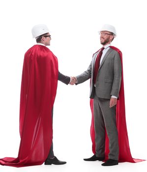 architect and developer in capes super heroes shaking hands