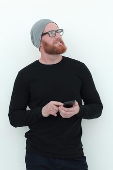 beautiful bearded man with smartphone looking at blank space