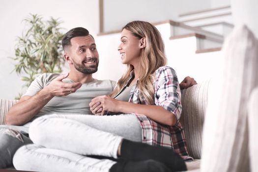 loving couple relaxing on the couch on a free evening