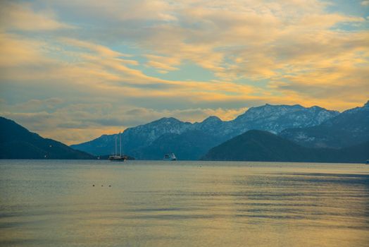 MARMARIS, TURKEY: View from Marmaris beach to the sea and mountains in the snow in winter.