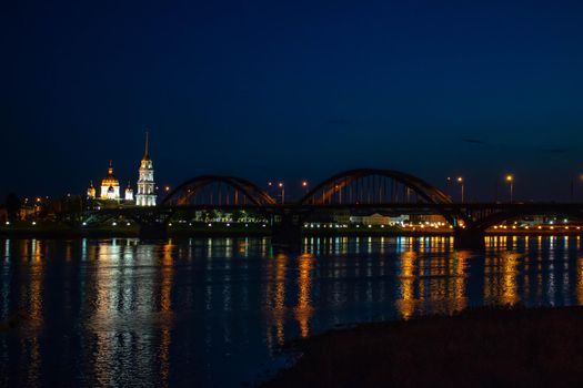Bridge across the river at night in Rybinsk Russia.sky