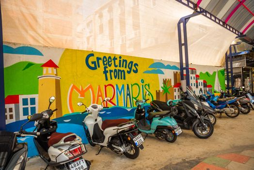 MARMARIS, TURKEY: Motorcycles are standing at the Drawing on the wall with the inscription Greeting from Marmaris.