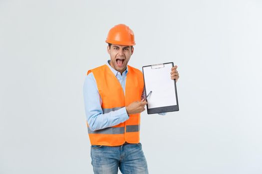 worker with orange helmet and jeans checking the stage of the project
