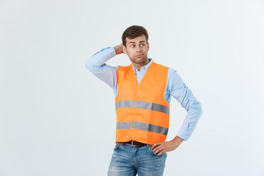 Serious engineer standing with looking away studio shot isolated on white.
