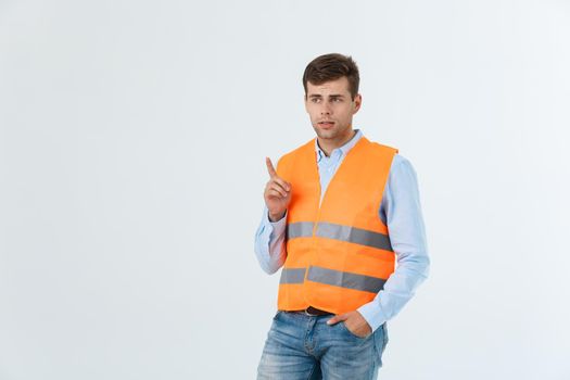 Portrait of happy young foreman with orange vest isolated over white background.