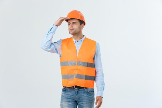 engineer in a helmet looks to the side view side view