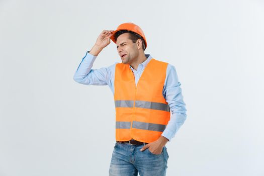 Young workman annoyed angry in furious gesture. Negative expression on white grey background