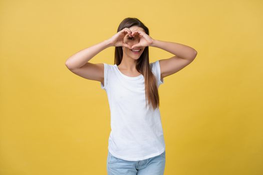 Healthy Eyes And Vision. Portrait Of Beautiful Happy Woman Holding Heart Shaped Hands Near Eyes. Closeup Of Smiling Girl With Healthy Skin Showing Love Sign. Eyecare. High Resolution Image.