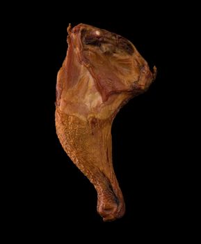 Appetizing smoked chicken legs, Ice, on a black background in isolation, poultry meat, chicken smoked meat