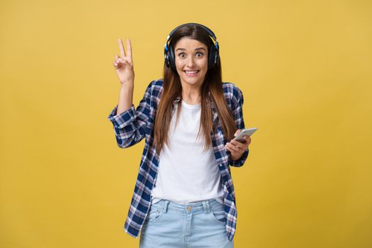 Portrait of music lover listening music and gesturing with two fingers.