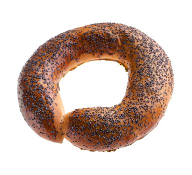 Ruddy bagel with top sprinkled with poppy seeds, on a white background in isolation