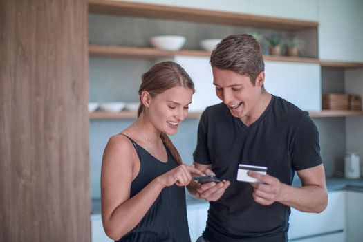 young couple choosing shopping in online store