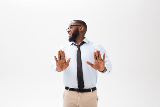 African American businessman doing surprise gesture on white background